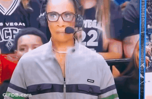 A Woman Wearing Glasses And Headphones With The Number 22 On Her Jersey GIF