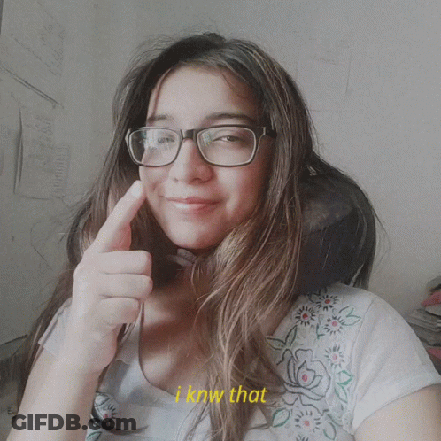 A Woman Wearing Glasses Giving A Thumbs Up With The Words I Know That Behind Her GIF