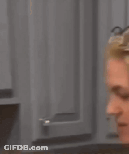 A Woman Wearing Glasses Has The Words And Swallow It On Her Face GIF