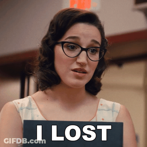 A Woman Wearing Glasses Holds A Sign That Says I Lost GIF