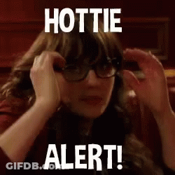 A Woman Wearing Glasses Is Covering Her Ears With Her Hands And The Words `` Hottie Alert ! '' GIF
