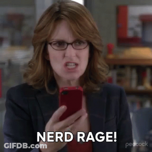 A Woman Wearing Glasses Is Holding A Cell Phone And Says Nerd Rage . GIF