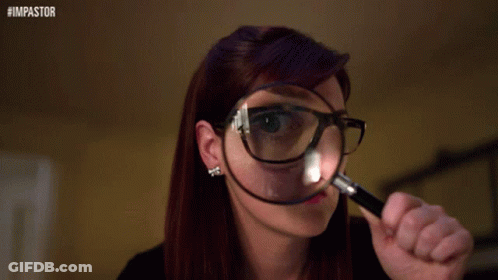 A Woman Wearing Glasses Is Looking Through A Magnifying Glass With The Hashtag #Impastor On The Bottom GIF