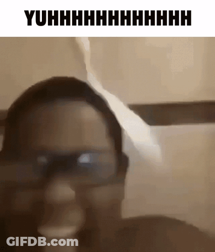 A Woman Wearing Glasses Is Making A Funny Face In A Black And White Photo . GIF