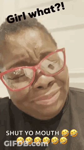 A Woman Wearing Glasses Is Making A Funny Face With The Words Girl What ? Shut Yo Mouth . GIF