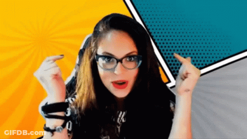 A Woman Wearing Glasses Is Pointing Her Finger At Something GIF