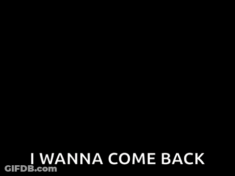 A Woman Wearing Glasses Is Sitting At A Table And Saying `` Surprise ! I Wanna Come Back '' . GIF