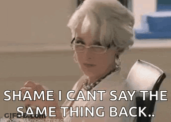 A Woman Wearing Glasses Is Sitting In A Chair And Saying `` Shame I Can 'T Say The Same Thing Back ... '' GIF