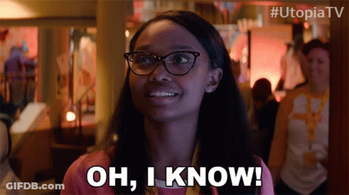 A Woman Wearing Glasses Is Smiling And Says Oh I Know GIF