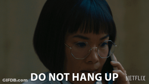 A Woman Wearing Glasses Is Talking On A Cell Phone With The Words Do Not Hang Up Netflix Below Her GIF