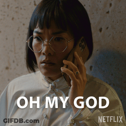 A Woman Wearing Glasses Is Talking On A Cell Phone With The Words Oh My God Written Below Her GIF