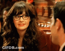 A Woman Wearing Glasses Is Talking To A Man . GIF