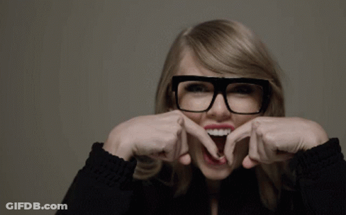 A Woman Wearing Glasses Making A Funny Face GIF