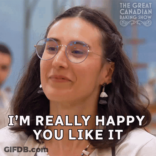 A Woman Wearing Glasses Says I 'M Really Happy You Like It . GIF