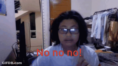 A Woman Wearing Glasses Says No No No In Red GIF