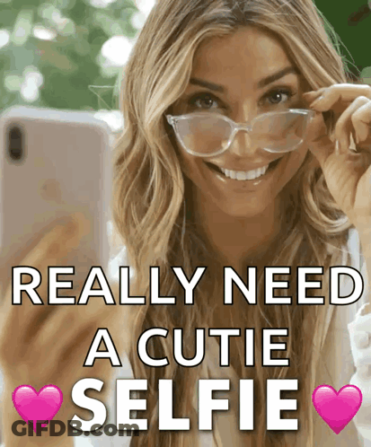A Woman Wearing Glasses Takes A Selfie With The Words Really Need A Cutie Selfie GIF