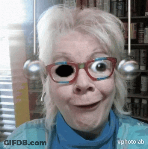 A Woman Wearing Glasses With A Black Hole In Her Eye And The Hashtag Photolab GIF