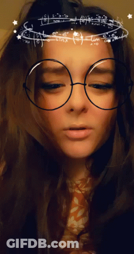 A Woman Wearing Glasses With Mathematical Equations On Them GIF