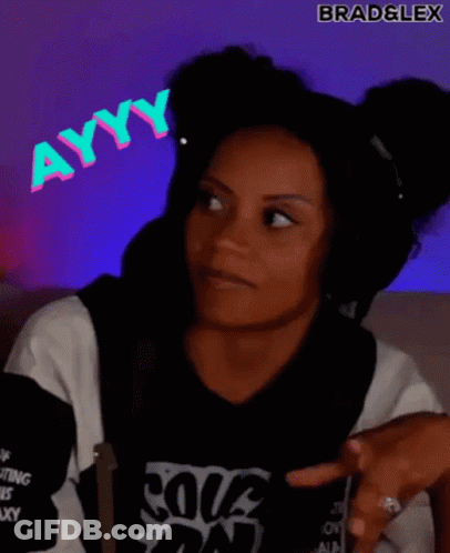 A Woman Wearing Headphones And A Black Shirt Is Making A Funny Face . GIF