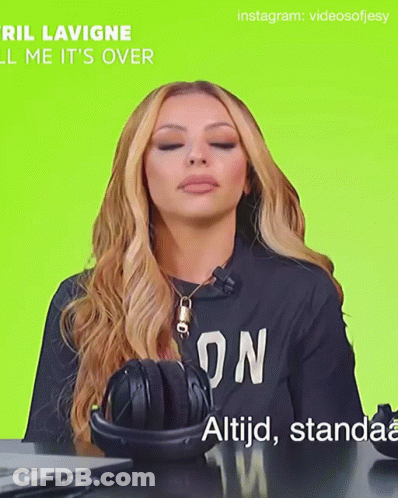 A Woman Wearing Headphones And A Black Shirt That Says ' On ' On It GIF