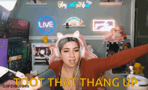 A Woman Wearing Headphones And A Cat Headband Says " Toot That Thang Up " GIF