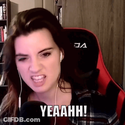 A Woman Wearing Headphones And A Red Gaming Chair Says Yeaahhh GIF