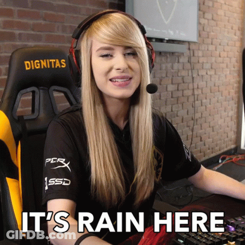 A Woman Wearing Headphones And A Shirt That Says Dignitas Sits In Front Of A Keyboard GIF