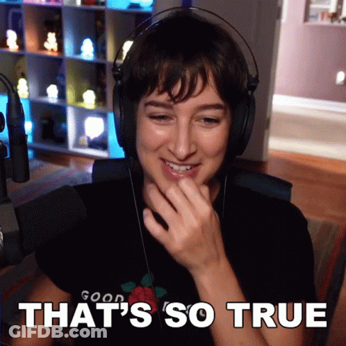 A Woman Wearing Headphones And A Shirt That Says Good On It GIF