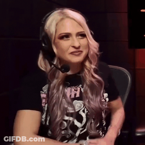A Woman Wearing Headphones And A T-Shirt That Says ' Ns ' On It GIF