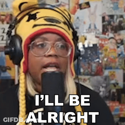 A Woman Wearing Headphones And A Tiger Hat Says I 'Ll Be Alright . GIF