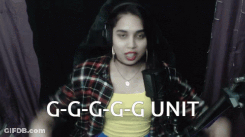 A Woman Wearing Headphones And A Yellow Tank Top Says " G-G-G-G-G Unit " GIF