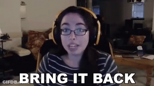 A Woman Wearing Headphones And Glasses Is Sitting In Front Of A Computer Screen . GIF