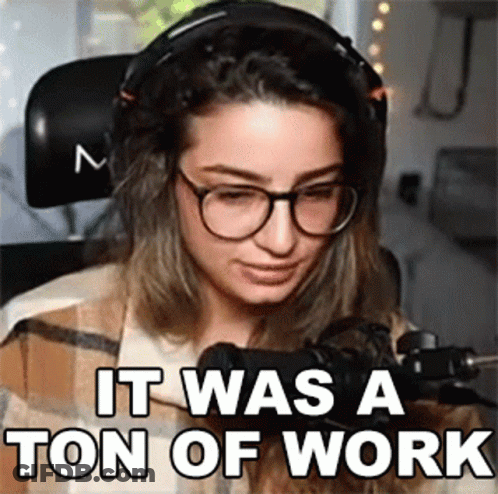 A Woman Wearing Headphones And Glasses Is Sitting In Front Of A Microphone And Says It Was A Ton Of Work . GIF