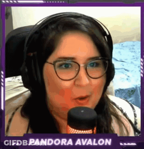 A Woman Wearing Headphones And Glasses Is Talking Into A Microphone With The Name Pandora Avalon Above Her GIF