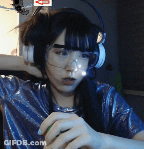 A Woman Wearing Headphones And Goggles Has An Arrow Pointing Up GIF