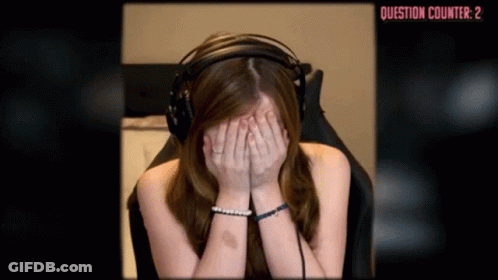 A Woman Wearing Headphones Covering Her Face With Her Hands In Front Of A Question Counter That Reads Question Counter 2 GIF