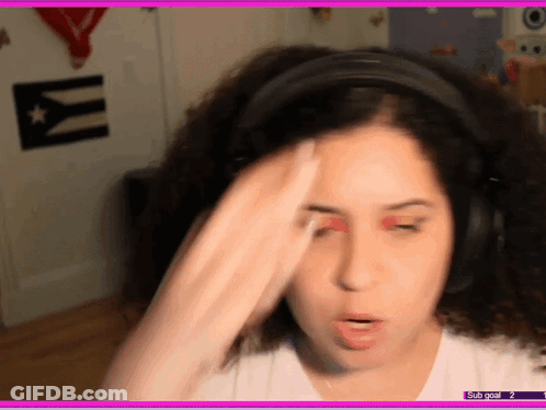 A Woman Wearing Headphones Has A Sub Goal Of 2 On The Bottom Of The Screen GIF
