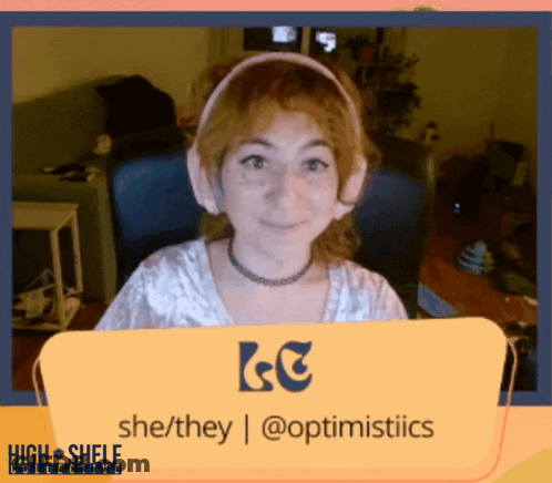 A Woman Wearing Headphones Is Behind A Sign That Says She / They | @Optimistics GIF