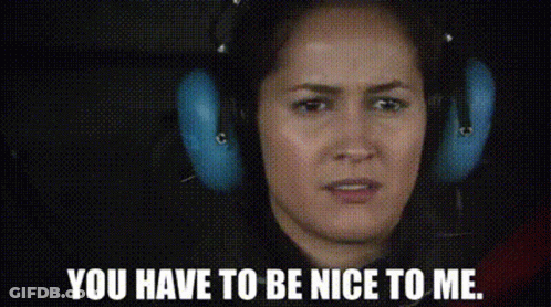 A Woman Wearing Headphones Is Making A Face And Saying `` You Have To Be Nice To Me '' . GIF