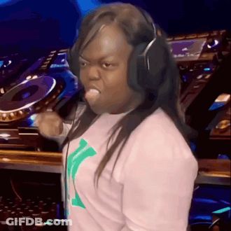 A Woman Wearing Headphones Is Making A Funny Face In Front Of A Dj GIF