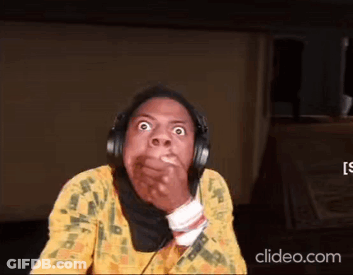 A Woman Wearing Headphones Is Making A Funny Face While Covering Her Mouth . GIF