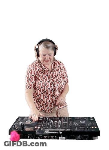 A Woman Wearing Headphones Is Playing Music On A Pioneer Dj GIF