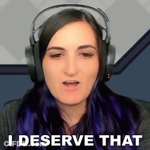 A Woman Wearing Headphones Is Saying " I Deserve That " GIF