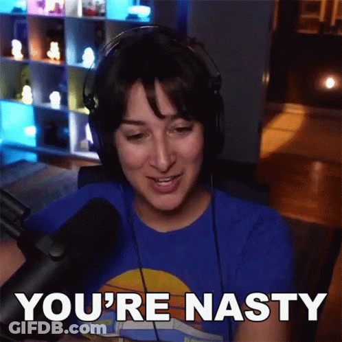A Woman Wearing Headphones Is Saying You 'Re Nasty GIF