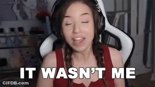 A Woman Wearing Headphones Is Sitting In A Chair And Says `` It Wasn 'T Me '' . GIF
