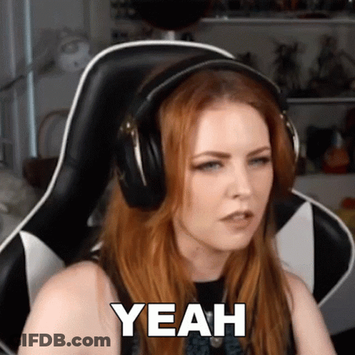 A Woman Wearing Headphones Is Sitting In A Chair And Says Yeah GIF