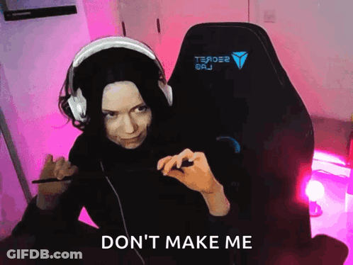 A Woman Wearing Headphones Is Sitting In A Chair With The Words " Do N't Make Me " Written On The Bottom GIF