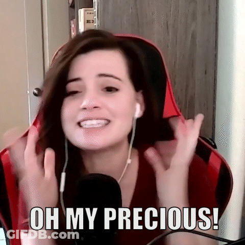 A Woman Wearing Headphones Is Sitting In Front Of A Microphone And Says Oh My Precious ! GIF