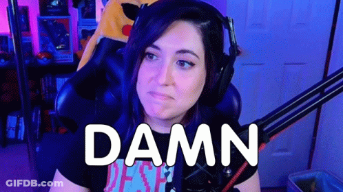 A Woman Wearing Headphones Is Sitting In Front Of A Microphone With The Words `` Damn '' Written On Her Face . GIF
