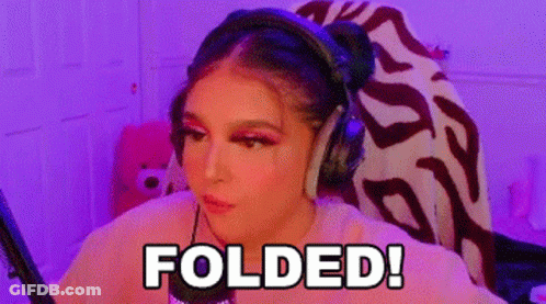 A Woman Wearing Headphones Is Sitting In Front Of A Microphone With The Words Folded Written On Her Face . GIF